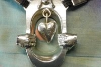BDSM Clitoral Restraint with Heart and Hands.
